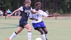 DAILY LEADER / NATALIE DAVIS / Co-Lin defender Casherry Russell battles Southwest Krystal Chailland for possession of the ball Friday at Wesson.