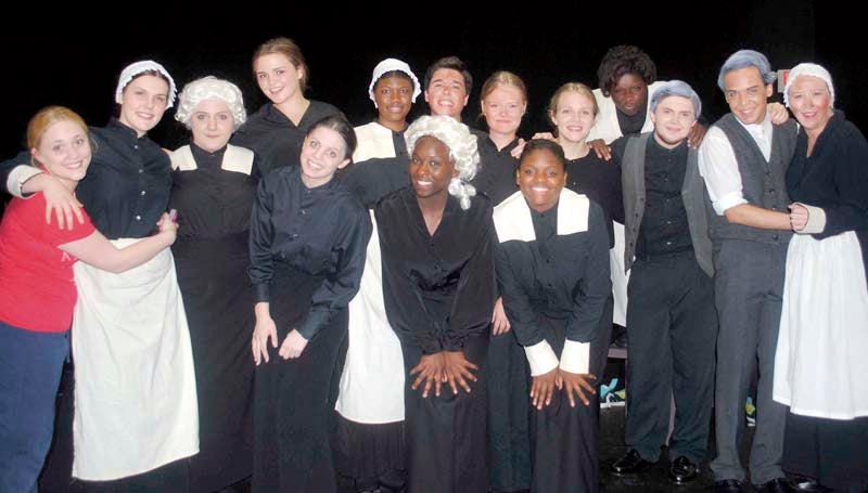 DAILY LEADER / JUSTIN VICORY / The cast of "The Crucible" gathers on stage for a group photograph after rehearsal Wednesday night. Showtime for the play is set for Thursday, Friday and Saturday night at the Mississippi School of the Arts. 