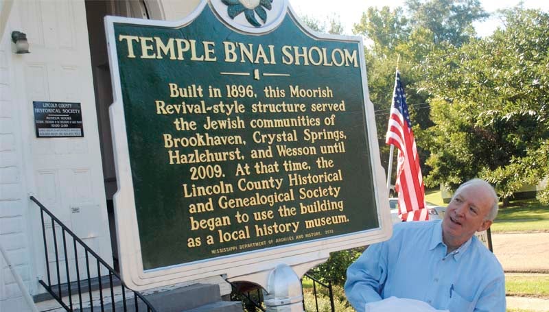DAILY LEADER / JUSTIN VICORY / Hal Samuels unveils a new historic marker for the B'nai Shalom Temple in front of the Lincoln County Historical and Genealogical Museum Wednesday. 
