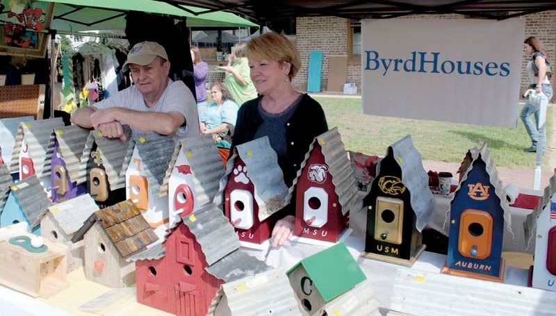 DAILY LEADER / JUSTIN VICORY / Jimmy and Jenie Byrd sell homemade birdhouses at the Wesson Flea Market Saturday. They were among more than 100 vendors at the event. 