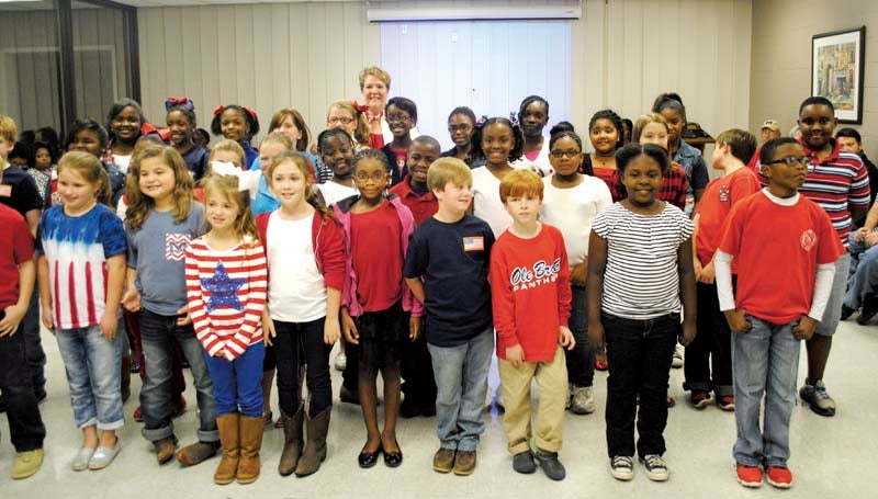 DAILY LEADER / JUSTIN VICORY / Students from Brookhaven Elementary School dress up in red, white and blue and sing patriotic songs to open Tuesday night's school board meeting. 
