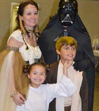 Dr. Ryan Case and wife Wendi and children, Olivia and Corey Case, portray the adult and child-age versions of the Star Wars characters at the BARL event.