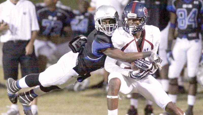 DAILY LEADER / JONATHON ALFORD / Co-Lin sophomore defender Greg Sims leaps to make a tackle on Southwest receiver Bodarius Johnson Thursday night at Stone Stadium.