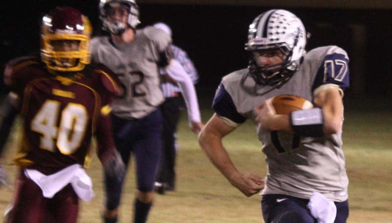 DAILY LEADER / CAROL BULLOCK / Bogue Chitto quarterback Brock Roberts sweeps to outside for positive yards against the Hinds AHS Bulldogs Friday night.