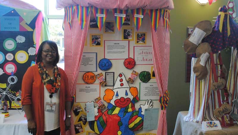 DAILY LEADER / JUSTIN VICORY / Showing off this year's performance improvement first prize-winning display created by the financial services department of King's Daughters Medical Center is Merida Johnson, RN, MSN and CPHQ at KDMC.