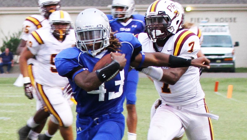 DAILY LEADER / NATALIE DAVIS / Co-Lin running back DeLance Turner (43) gets away from Pearl River's Emmanuel Ray (7) Saturday at Stone Stadium.