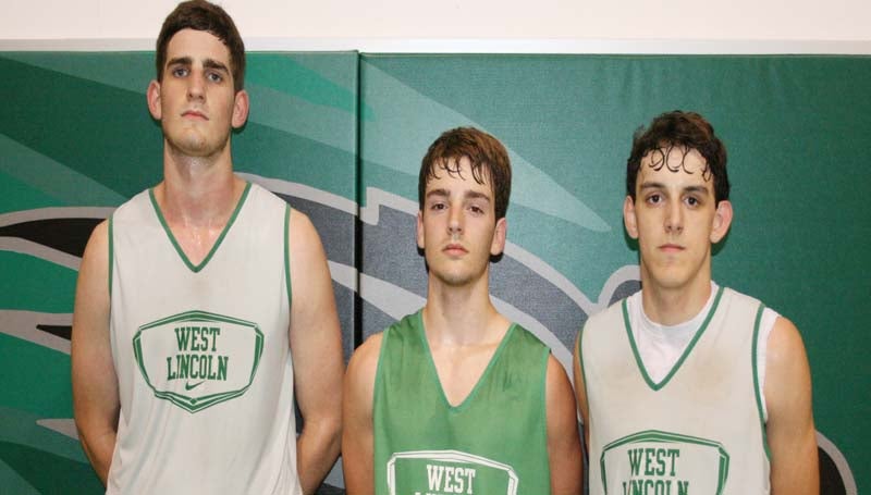 DAILY LEADER / MARTY ALBRIGHT / West Lincoln seniors (from left) Sam Bivens, Sid Griffin and Chase Buckles are excited to begin their 2013-14 basketball season.
