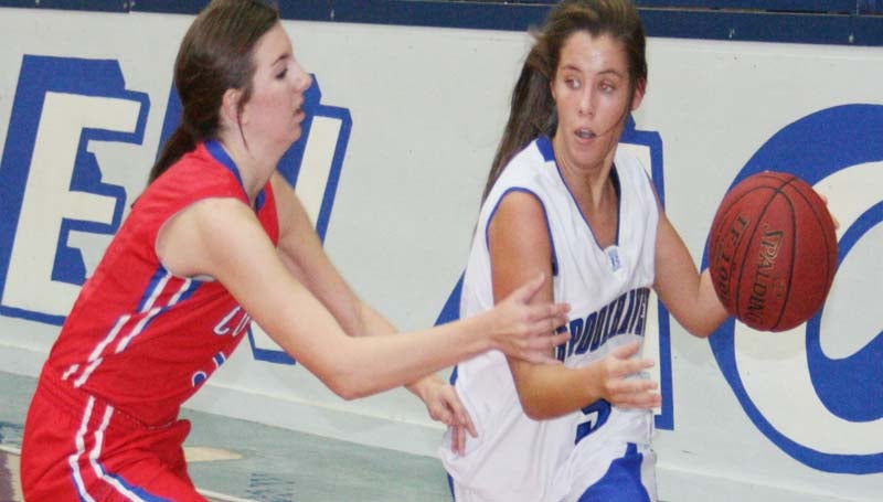 DAILY LEADER / MARTY ALBRIGHT / Brookhaven Academy's guard Madison Warren (right) drives past Copiah Academy defender Tuesday night.