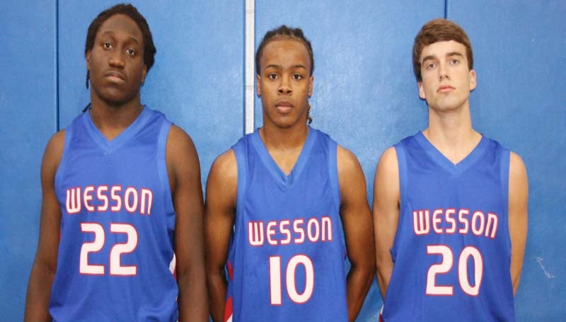 DAILY LEADER / MARTY ALBRIGHT / Representing the Wesson Cobras in the 2013-14-basketball season are seniors (from left) Nick Lewis, Marquis Lofton and Tanner Allen.