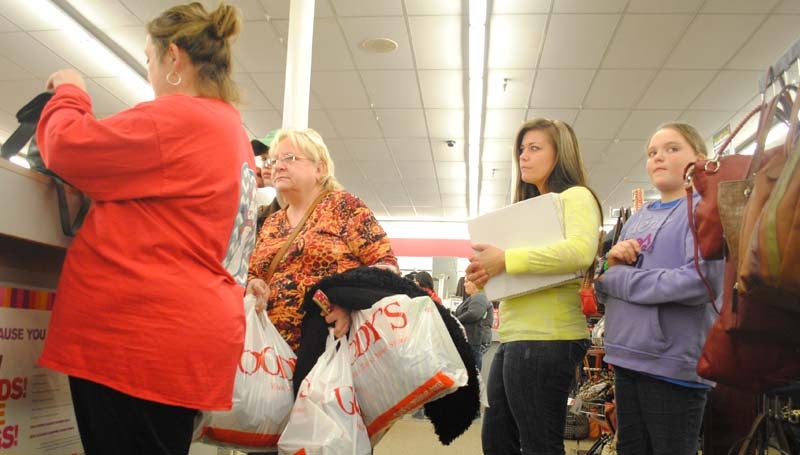 THE DAILY LEADER / JUSTIN VICORY / Leanne McCaffery (from left), Seth McCaffery, Debbie Querns, Melissa Morgan and Heidi Smith get a jump start on Black Friday shopping at Goody's Thursday night.