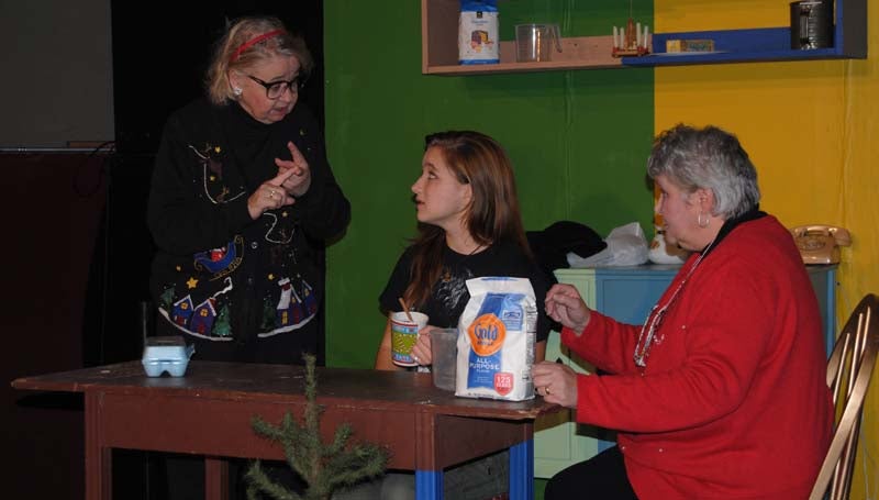 MATTHEW COLEMAN / In preparation for the upcoming Brookhaven Little Theatre production of "Fruitcakes," Mickey Ramsey (from left), Johanna Russell and Lee Moore discuss plans for baking the holiday dessert during rehearsals this week at The Haven. The play opens Friday at 7:30 p.m. and continues Saturday at 7:30 p.m. and Sunday at 2 p.m. Future performances are Friday and Saturday, Dec. 13-14, at 7:30 each night.