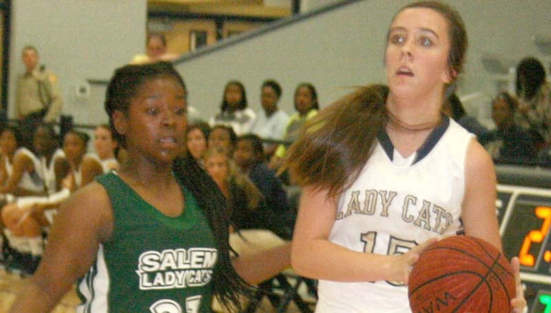DAILY LEADER / MARTY ALBRIGHT / Bogue Chitto's guard Karlie Williams (15) drives past Salem's defender Zoie Bridges (23) Thursday night.