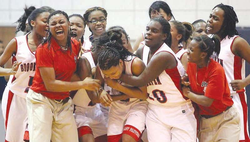 DAILY LEADER / JONATHON ALFORD / Brookhaven's Fredericka Fairman (center) is congratulated by her teammates after hitting the game-winning shot against Lawrence County Friday night in Sinclair Gymnasium.