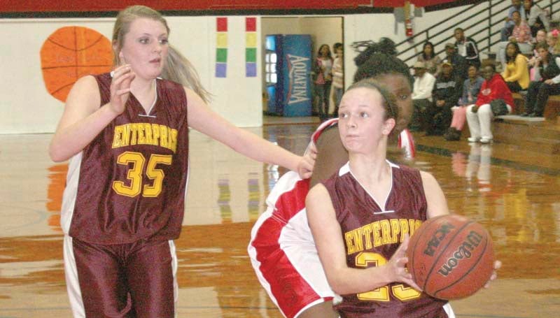 DAILY LEADER / MARTY ALBRIGHT / Lady Jackets guard Carlee Nations (23) drives in for the lay-up as her teammate, Karlee Burgess, (35) looks on Thursday night in girls' junior high action at Loyd Star.