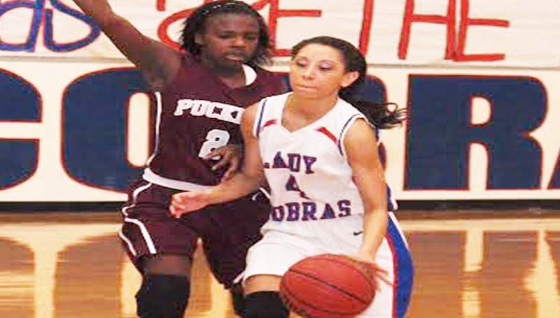 DAILY LEADER / TRACY FISCHER /  Wesson Brandi McInnis (4) drives past Puckett's defender Kyeesha Melvin (2) Tuesday night at the Snake Pit.