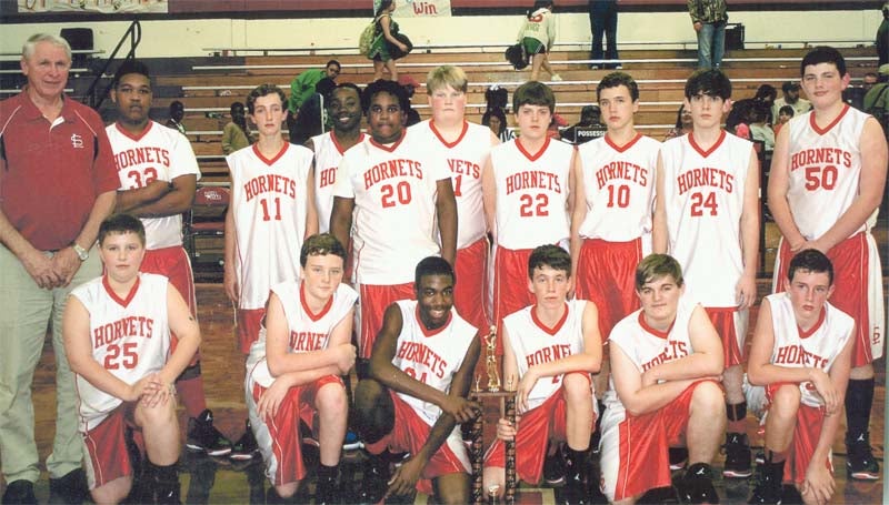 DAILY LEADER / SUBMITTED / The Loyd Star Hornets captured their third straight junior high basketball conference crown and finished the season with an 11-1 record. Representing the Hornets are (from left, kneeling) Rials Hester, Cullen Keene, Patrick Price, Cade Hodges, Clay Smith, Dane Smith; (back row) Coach Gene 'Moochie' Britt, Terrance Fields, Jett Calcote, Zaycheous Vaughn, Zabien Price, Cam Harveston, Braden Ezell, Brent Cade, Micah Calcote and Gage Netterville.