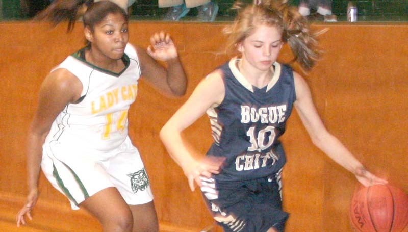DAILY LEADER / MARTY ALBRIGHT / Bogue Chitto's Mattie Avants (10) drives past Salem's Markeria Butler (14) Friday night in basketball action.