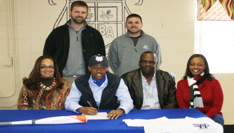 DAILY LEADER / MARTY ALBRIGHT / Brookhaven Academy outfielder Steven Williams has signed a baseball scholarship with the Southwest Community College Bears. Present for the ceremony were his parents (seated), Sheila and Steve Williams, his sister Alessia Tucker, (standing from left) Brookhaven Academy coach Casey Edwards and assistant coach David Gilbert.