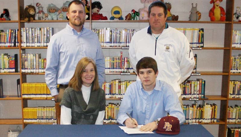 DAILY LEADER / MARTY ALBRIGHT / Bogue Chitto's pitcher/outfielder Brock Roberts signs a baseball scholarship with the Pearl River Community College Wildcats. With him are (seated) his mother, Debbie Roberts, (standing from left) BC baseball coach Russ Carter and BC football coach Gareth Sartin.