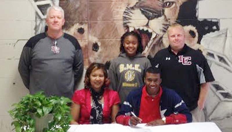 DAILY LEADER / PHOTO SUBMITTED / Lawrence County's Kewuan May has signed a baseball scholarship with the Copiah-Lincoln Community College Wolves. Present for the ceremony were his mother, Felisha May; (standing, from left) Lawrence County assistant coach Craig Davis; Kewuan's sister Shania Harris; and Lawrence County head coach Corey Keyes.