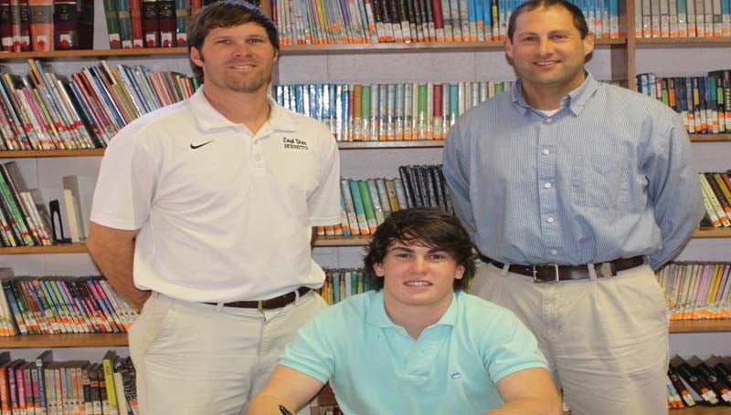 DAILY LEADER / PHOTO SUBMITTED / Loyd Star outfielder Seth Farmer has signed a letter of intent to play baseball for the Pearl River Community College Wildcats next year. Pictured with Seth are (from left) Loyd Star coaches Jared Britt and Jonathan Breakfield.