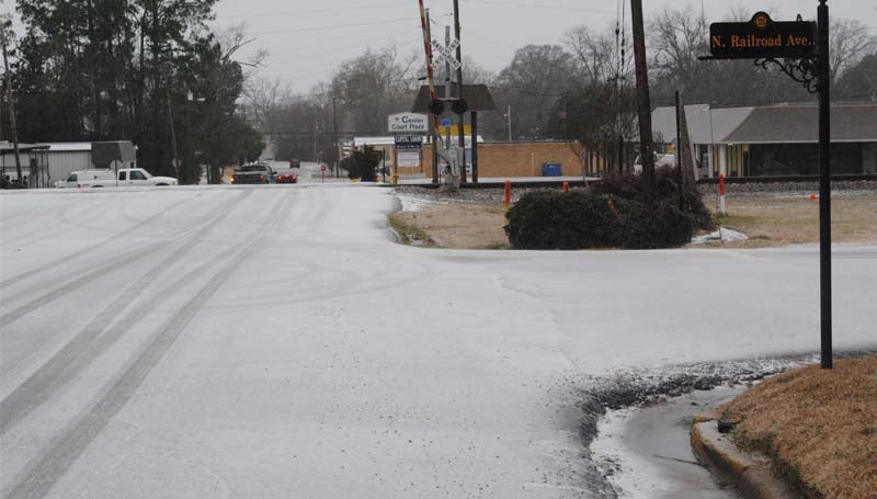 THE DAILY LEADER / JUSTIN VICORY / As sleet falls in the area Tuesday morning, an icy coating blankets the intersection of North Railroad Ave. and East Court St. Tuesday morning. 