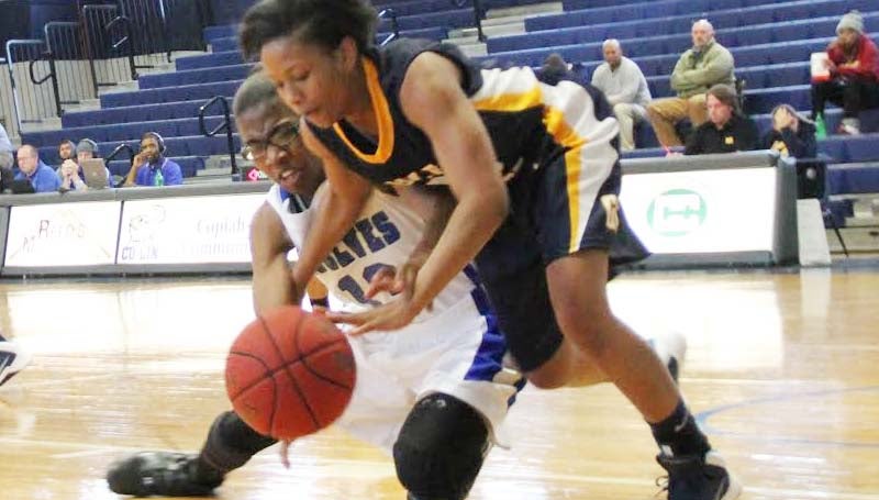CO-LIN MEDIA / NATALIE DAVIS / Co-Lin's Ashley Minor (13) battles Gulf Coast's CiCi Brown (23) for possession Friday afternoon in Mullen's Gymnasium.