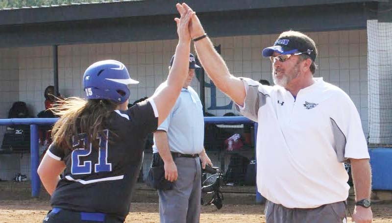 CO-LIN MEDIA / NATALIE DAVIS / Co-Lin head coach Allen Kent gives a high-five to Breanna McKenzie (21) after she slugged a grand slam. McKenzie, a North Pike product, had five hits and five RBIs in her debut.