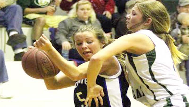 DAILY LEADER / SHERYLYN EVANS / Brookhaven Academy's Madison Warren (5) is foul by Central Hinds' Summer Hartley (1) while driving to the basket Friday night in Raymond.
