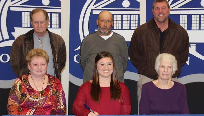 CO-LIN MEDIA / NATALIE DAVIS  / Copiah Academy softball standout Kaitlyn Taylor (seated center) signs to play with the Co-Lin Lady Wolves. Present for the signing were her grandmothers, Becky McIntyre (seated left) and Louann Taylor (seated right), grandfather Mac MeIntyre (standing left), father Rodney Taylor, and Copiah Academy softball coach Terry Bauer.