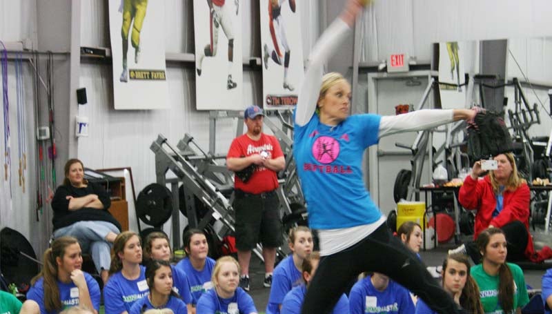 DAILY LEADER / MARTY ALBRIGHT / Olympic and Sports Illustrated star Jennie Finch demonstrates her pitching techniques in Saturday's softball camp at KDMC Performance Center.