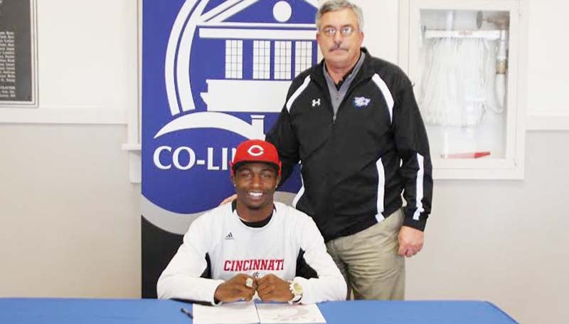 CO-LIN MEDIA / NATALIE DAVIS / GLADNEY SIGNS WITH CINCINNATI - Copiah-Lincoln Community College (Miss.) wide receiver Casey Gladney of Columbia has signed with the University of Cincinnati. In his two years at Co-Lin, the Wolfpack posted a 16-5 record, winning the MACJC State Championship in 2012. Pictured with Gladney is Co-Lin head coach Glenn Davis.