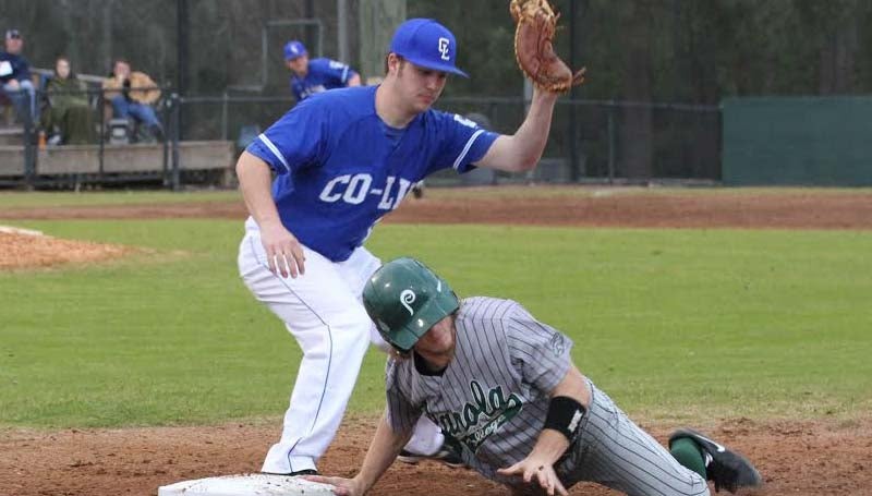 CO-LIN MEDIA / NATALIE DAVIS / Co-Lin first baseman Konner Burke tags out a Panola runner on a pick-off play Friday in baseball action.