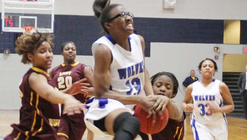 CO-LIN MEDIA / NATALIE DAVIS / Co-Lin sophomore Ashley Minor (13) is fouled by Hinds Latorya Richmond (1) while driving in for a layup Monday night at Mullen Gymnasium.