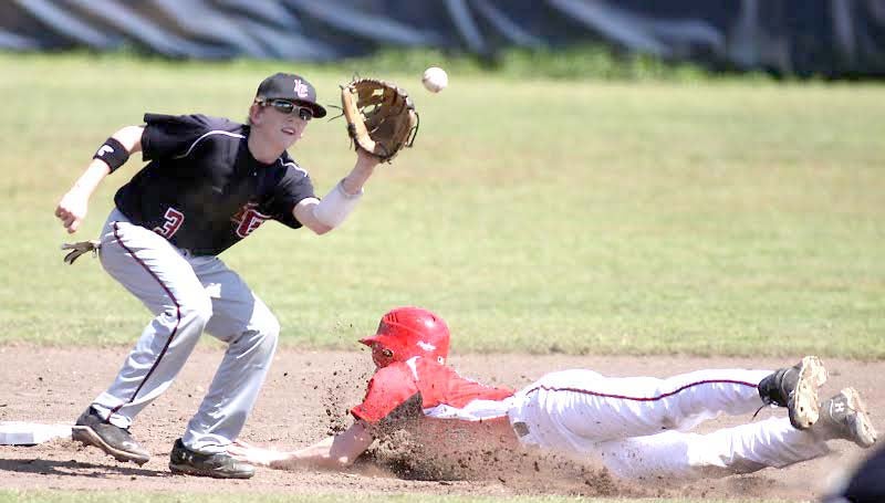 DAILY LEADER / JONATHON ALFORD / Loyd Star's runner Levi Redd slides into second base safely before Lawrence County shortstop Kasey Durr could make the tag Saturday.
