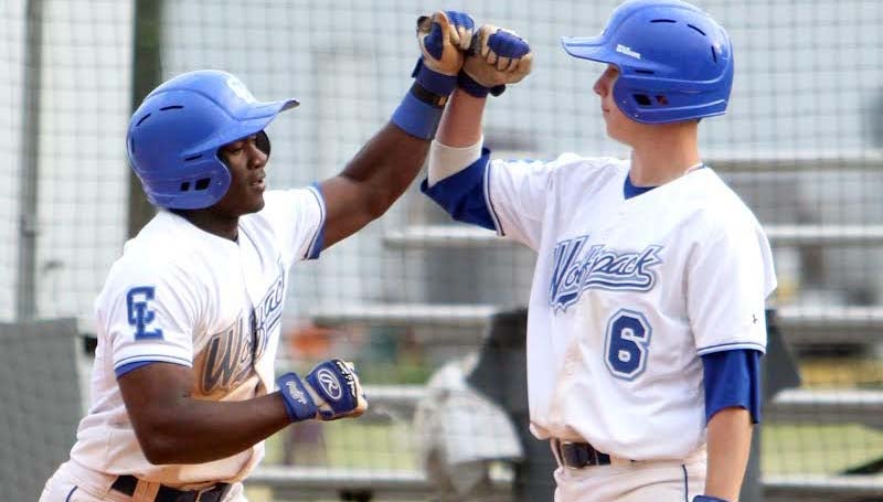 DAILY LEADER / SHERYLYN EVANS / Co-Lin's Wesley Watts (6) congratulates his teammate Dominic Savage (1) at the plate on his two-run homerun in Game One of the doubleheader against East Central Friday afternoon.