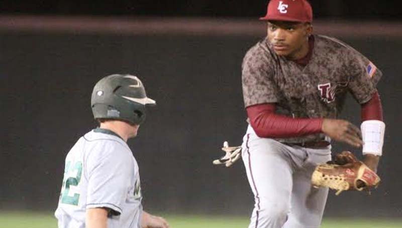 DAILY LEADER / JONATHON ALFORD / Lawrence County's T-Tex Cole (right) helps his team record a double play Friday night against West Jones in the Southwest Mississippi Spring Break Baseball Classic, at Jimmie Davis Park.
