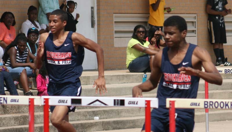 DAILY LEADER / MARTY ALBRIGHT / Brookhaven's Darius Calvin and Tyjah Black compete in the boys 110-meter hurdles Saturday.