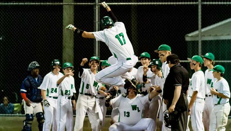 DAILY LEADER / TERESA ALLRED / West Lincoln's Brady Wilson (17) leaps for joy after hitting a home run for the Bears while his teammates wait around home plate to congratulate him Friday night.