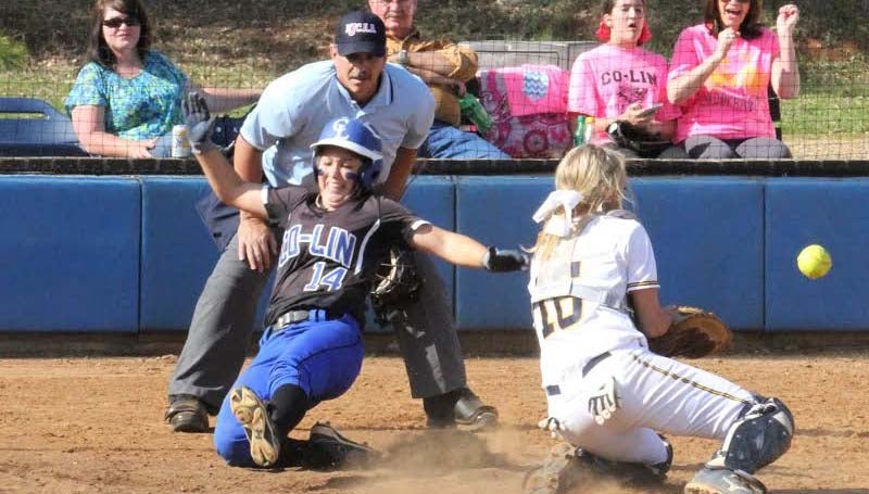 CO-LIN MEDIA / NATALIE DAVIS / Co-Lin shortstop Brooke Laigast slides safely into home as the Lady Bulldog catcher Dani Craft tries to make the play.