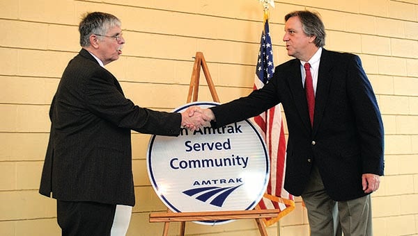 THE DAILY LEADER / JUSTIN VICORY / Amtrak CEO Joe Boardman shakes Mayor Joe Cox's hand after unveiling a plaque at the Godbold Transportation Center Wednesday. 