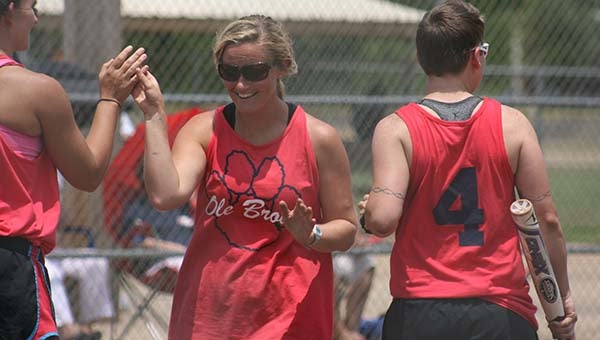 DAILY LEADER / MARTY ALBRIGHT / Ole Brook Alumni Sabrina Smith is congratulated at home plate by her teammates Katie Stewart (left) and Teri Hodges after hitting a home run Saturday in the First Annual Lady Panthers Area Alumni Tournament at Hansel King Sportsplex.