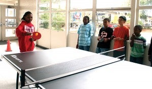 Daymiyah Barnes practices hitting the ball during Ping Pong Club.