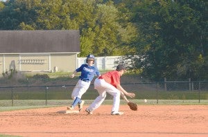 Photo by Anthony McDougle/ A Brookhaven Academy base runner safely reaches base as Loyd Star’s second baseman attempts to corral the baseball.