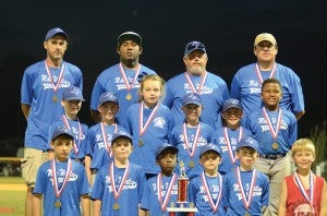 Photo by Anthony McDougle/  Mike Whatley  placed second in the 7- and 8-year-old Dixie Youth Baseball tournament. Members of the team are Charles Burgess Jr., John Cain, Cooper Jordan, Hayes Jordan, Glen Lewis, Braxton Orr, Kamryn Perkins, Joseph Shumaker, Tucker Smith, Tuvker Vining, Durrell Washington Jr., Dawson White and Layton Woolley. Coaches are Brian Lewis, Troy Orr, Durrell Washington and Scotty White.