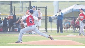 Photo by Anthony McDougle/  American All-Star pitcher Landon Banes winds up to deliver a pitch during the team’s first game of the tournament against the Pike American All-Stars. The Lincoln All-Stars were defeated by the Pike Americans 10-0 in five innings at the Lincoln Civic Center Baseball Complex Friday night.  